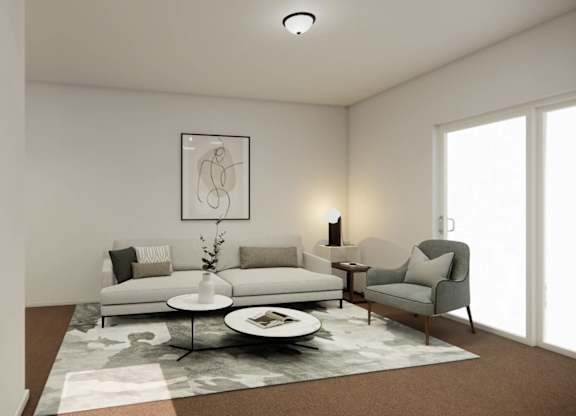 A modern living room with a white sofa set and a grey armchair.