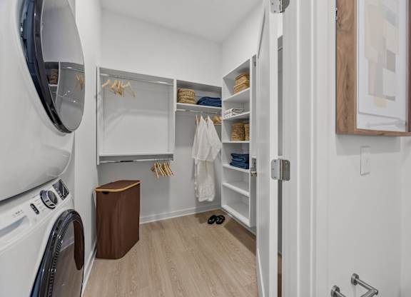 A small laundry room with a washer and dryer.at Adler Montford Park + Drexel Townes, Charlotte, NC, 28209