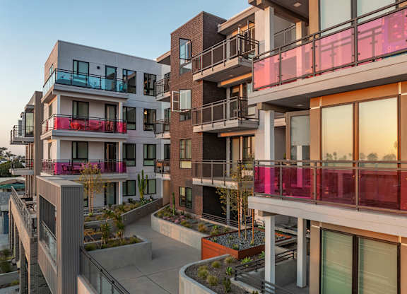 Modern apartment complex with colorful balconies at AMP 30 Apartments, California, 92116