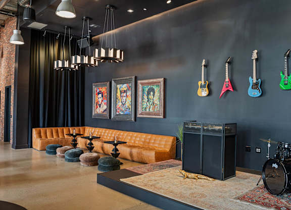 Music themed lounge with guitars and drum set at AMP 30 Apartments, San Diego, California