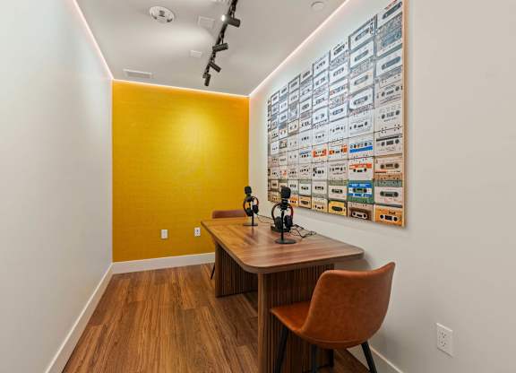 Podcast studio with vintage cassette tape wall art at AMP 30 Apartments, San Diego, 92116
