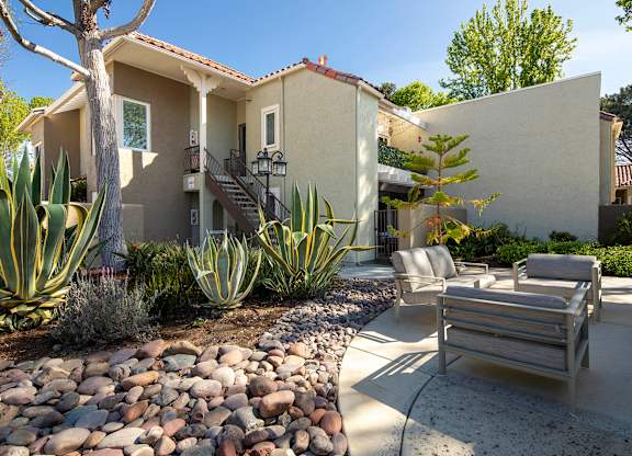 A house with a patio and a couch.