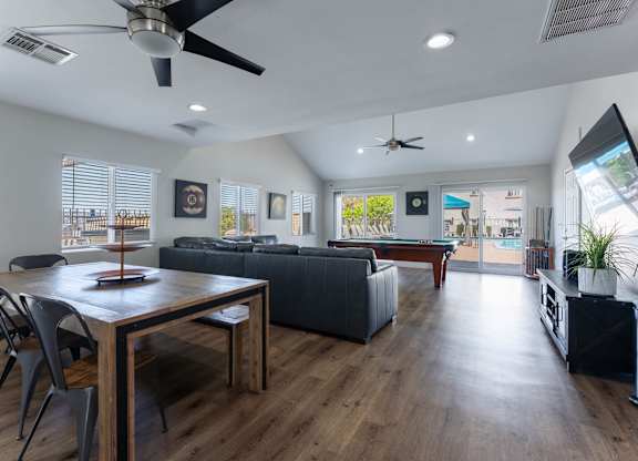 A modern living room with a dining table and a couch.