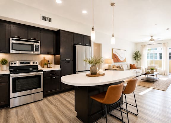 Open kitchen with dark cabinets and island