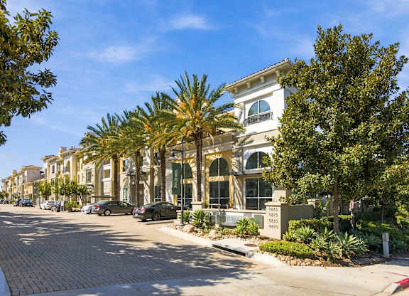 A street view of a residential area with a house number 983.