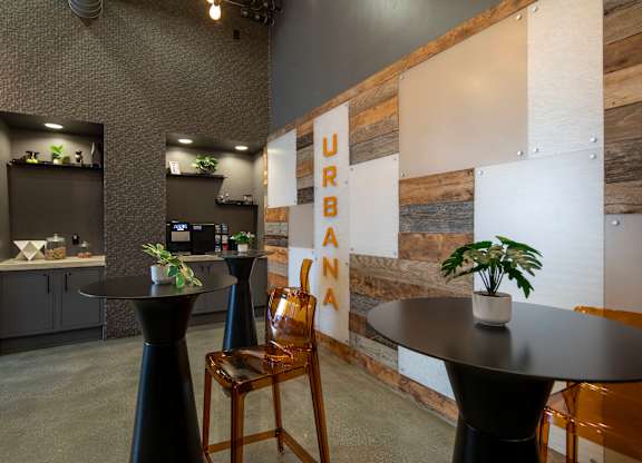 A room with a wooden wall and a sign that says