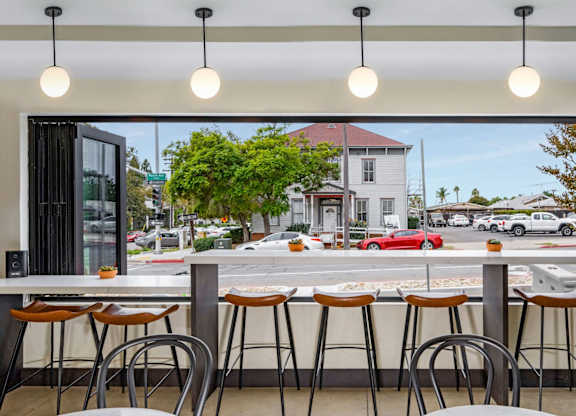 A bar with a view of the street outside.