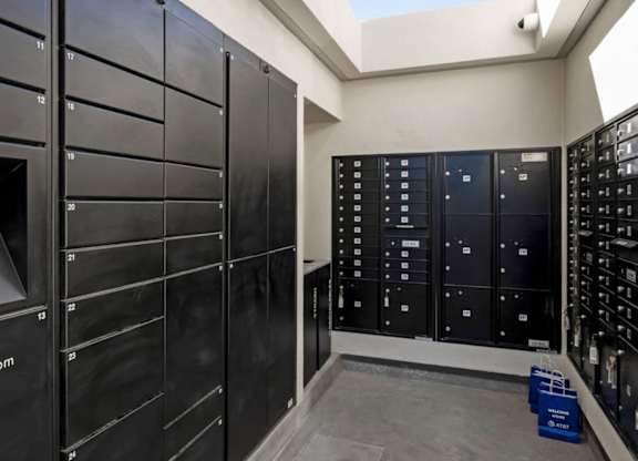A row of black lockers with the word LuxerOne.com on the first one.