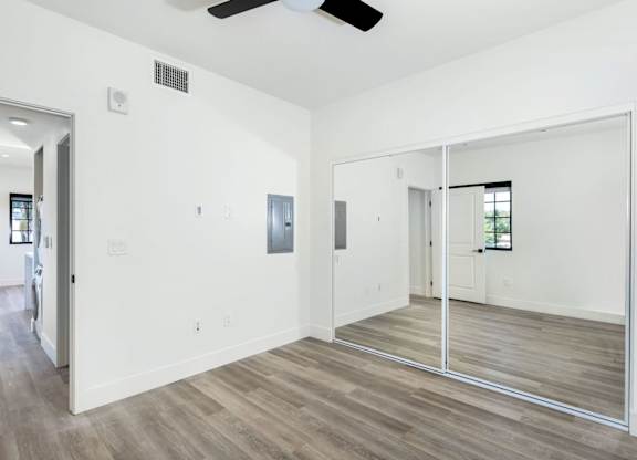 Bedroom with sliding glass closet doors