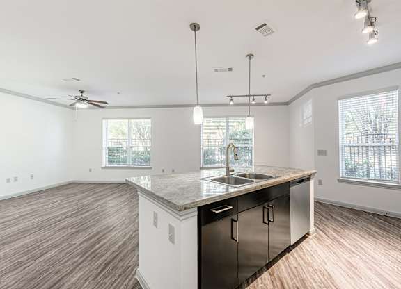 A kitchen with a sink and a countertop.
