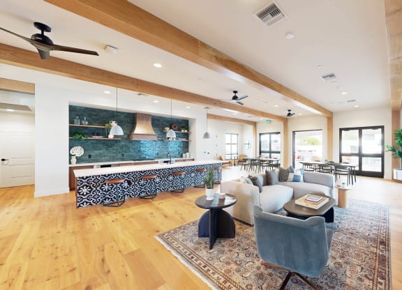 a living room with a couch and a table   and a kitchen at The Villas at Anacapa Canyon, Camarillo