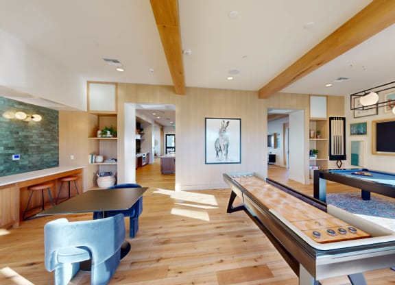 a games room with a pool table and a television at The Villas at Anacapa Canyon, Camarillo, CA
