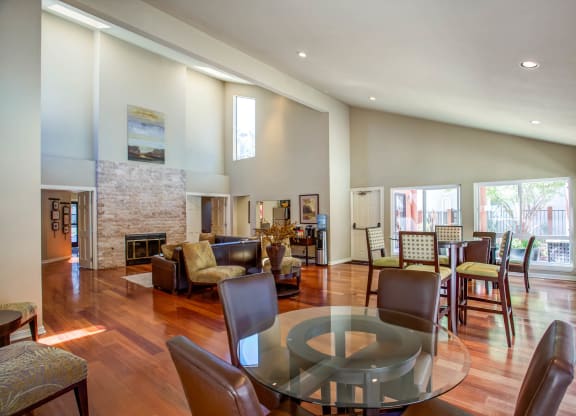 a living room with a glass table and a fireplace at Valley Plaza Villages, Pleasanton, California