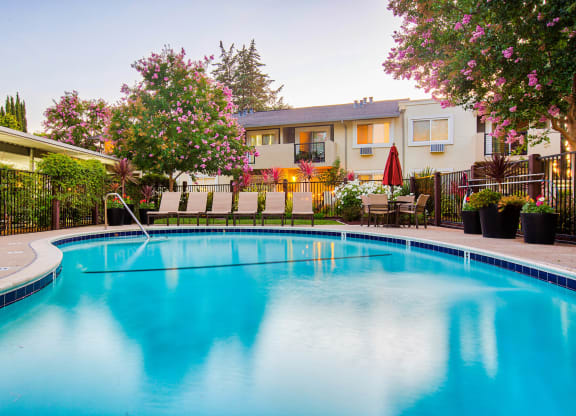 a swimming pool with a house in the background  at Pleasanton Place, California, 94566