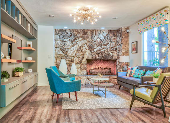 a living room with a stone walled fireplace  at Rancho Los Feliz, Los Angeles, 90039
