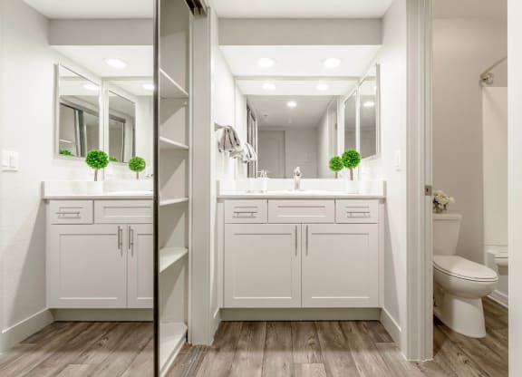 A bathroom vanity and closet at Sendero Huntington Beach, California