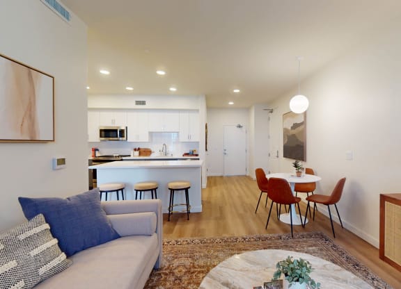 a living room with a couch and a table with chairs at The Villas at Anacapa Canyon, Camarillo, 93012