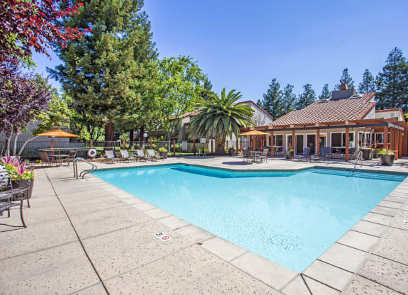 a swimming pool in front of a house with a pool at Valley Plaza Villages, Pleasanton, CA