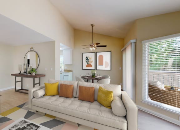 a living room with a couch in front of a window at Valley Plaza Villages, Pleasanton, CA