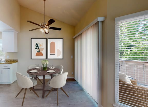 a dining room with a table and chairs and a ceiling fan at Valley Plaza Villages, Pleasanton