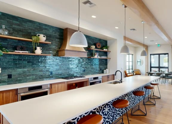 a large kitchen with a long white counter top at The Villas at Anacapa Canyon, California