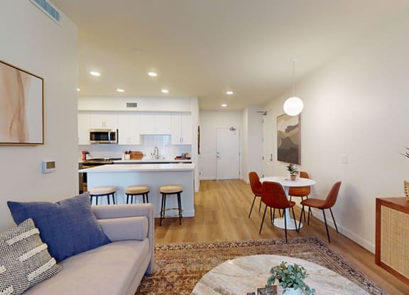 a living room and kitchen with a table and chairs at The Villas at Anacapa Canyon, California