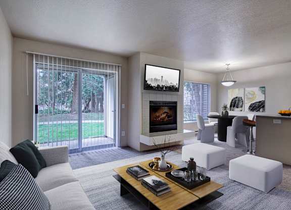Open-concept living room with a fireplace, patio doors, and a dining area.