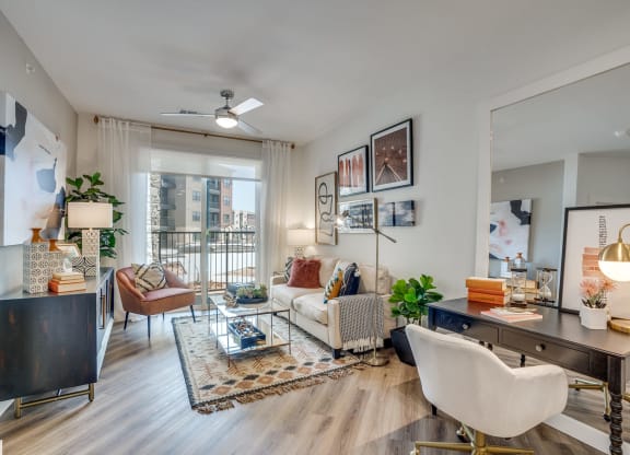 a spacious living room with white walls and hardwood flooring at Aurora Watson Branch, Mansfield