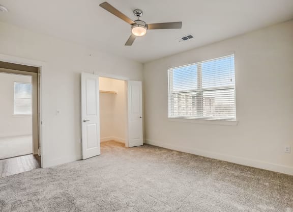 an empty living room with a ceiling fan and a window at Aurora Watson Branch, Mansfield, 76063
