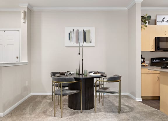 a dining room with a table and chairs at Artisan Apartments & Shops, Austin, TX