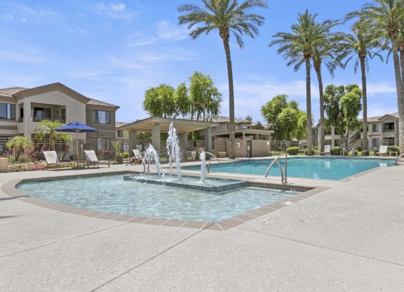 take a dip in the resort style pool at the whispering winds apartments in pearland, tx  at Adiamo Palm Valley, Goodyear, AZ, 85395