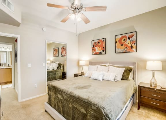 a bedroom with a large bed and a ceiling fan  at Adiamo Palm Valley, Arizona