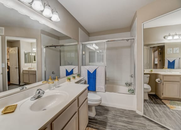 a bathroom with a sink and a shower and a toilet  at San Montego Apartments, Arizona