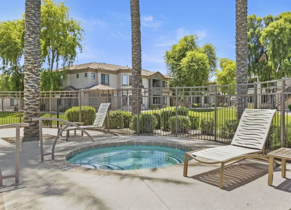 Hot tub surrounded by beautiful palm trees  at Adiamo Palm Valley, Goodyear, 85395