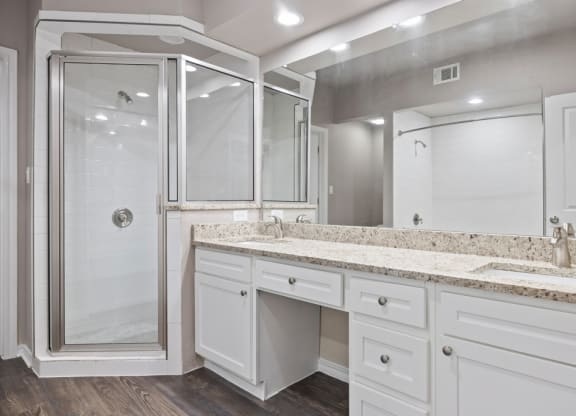 A bathroom with a sink and a shower at Waters Edge Apartment Homes, Texas