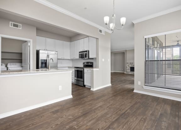 The avenues salt lake custom homes interior kitchen and living room at Waters Edge Apartment Homes, Georgetown