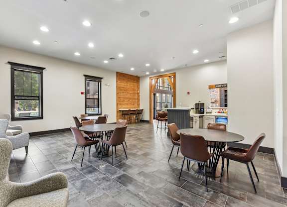 A room with a table and chairs in it.