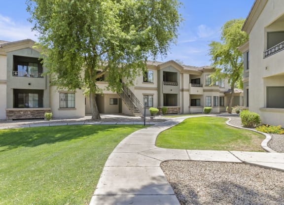 freshly painted exteriors and lush landscaping  at Adiamo Palm Valley, Arizona, 85395