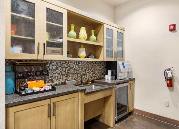a kitchen with a sink and cabinets and a fire hydrant at Lakeline East Apartments, Texas, 78613