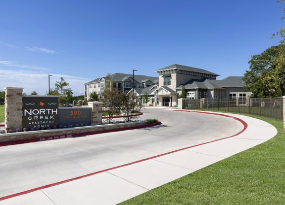 the entrance to the neighborhood apartments at North Creek, Hutto, TX