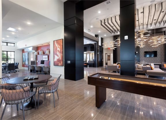 a living room with a pool table and a dining room at North Creek, Texas