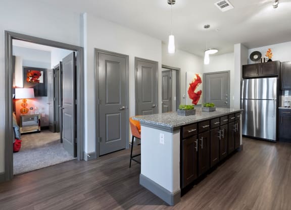 a kitchen with a large island in the middle of it at North Creek, Texas