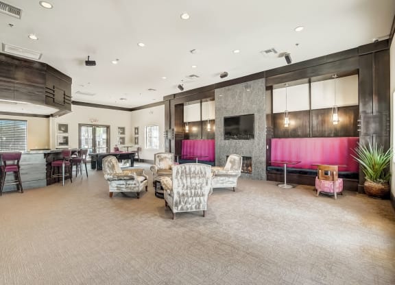 a living room with couches and chairs and a kitchen with a television  at Adiamo Palm Valley, Arizona