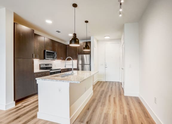 a kitchen with a large island and a stainless steel refrigerator at Aurora Watson Branch, Texas, 76063