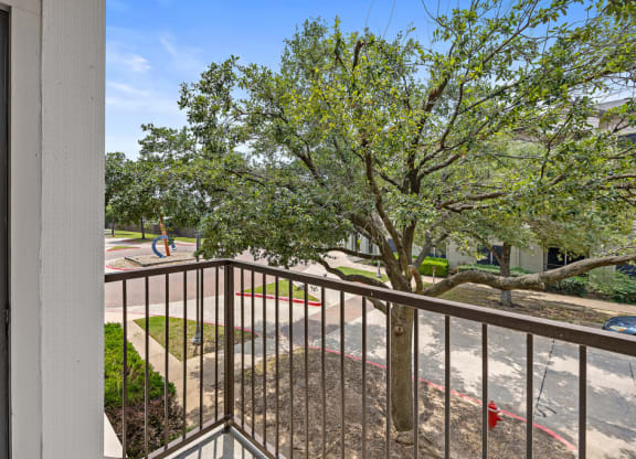 balcony with tree views at Artisan Apartments & Shops, Texas, 78729