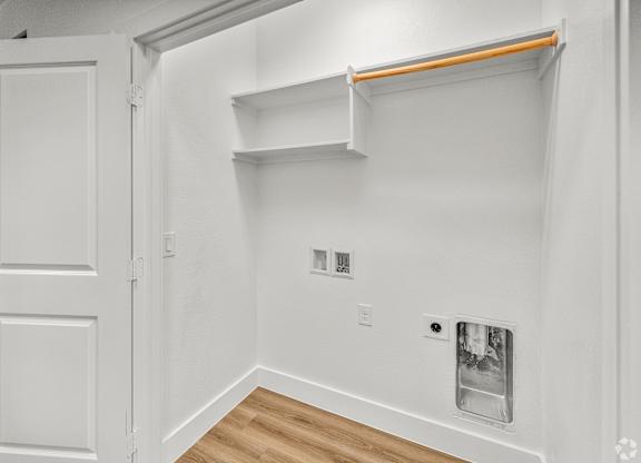 A white room with a door and a shelf. at Aurora Watson Branch, Mansfield, 76063