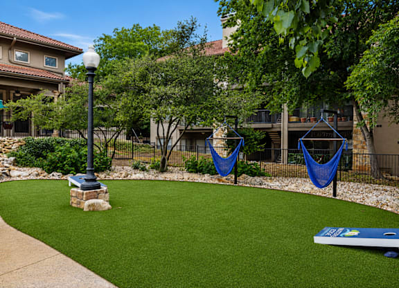 A small park with a bench and a playground.