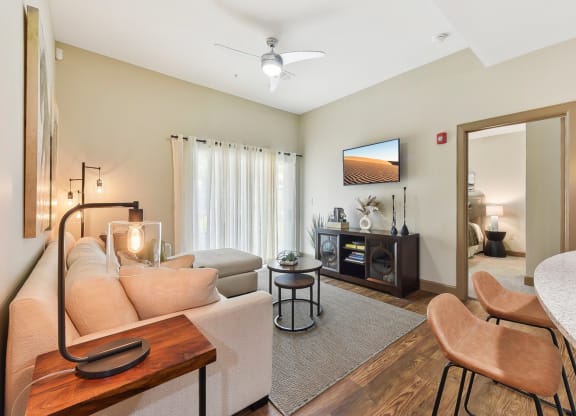 a living room with a couch and a table at Lakeline East Apartments, Cedar Park, 78613