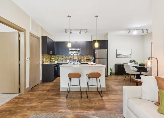 a view of a living room and kitchen with an open floor plan  at Lakeline East Apartments, Cedar Park, TX, 78613
