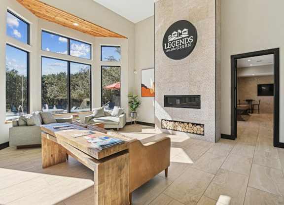 a living room with a fireplace and a wooden table